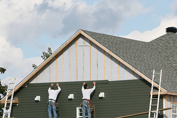 Professional Storm Damage Siding Repair technician working in Akron, IN